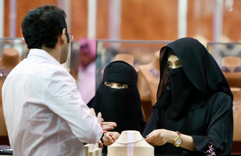 FILE - In this Saturday, March 21, 2009 file photo, Saudi women look at jewelry at a gold fair in Riyadh, Saudi Arabia. Human rights group Amnesty International says Saudi authorities have used an iron grip to consolidate power and unleashed a ruthless campaign of persecution against peaceful activists to silence criticism of the state. (AP Photo/Hassan Ammar, File)