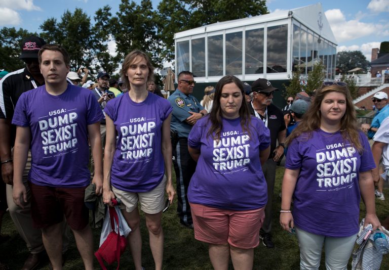Protesters with t-shirts that read 