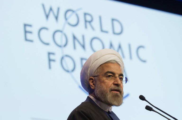 Iranian President Hassan Rouhani, speaks during a session of the World Economic Forum in Davos, Switzerland, Thursday, Jan. 23, 2014. Leaders gathered in the Swiss ski resort of Davos have made it a top priority to push to reshape the global economy and cut global warming by shifting to cleaner energy sources. (AP Photo/Michel Euler)