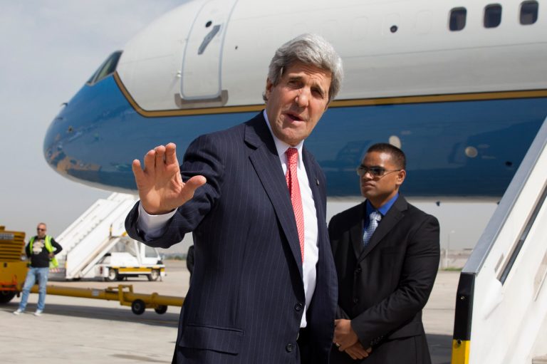 U.S. Secretary of State John Kerry says goodbye as he leaves Tel Aviv, Israel Tuesday April 1, 2014, continuing on to NATO meetings in Brussels after meeting in Israel with Israeli Prime Minister Benjamin Netanyahu about the Middle East peace process talks. (AP Photo/Jacquelyn Martin, Pool)