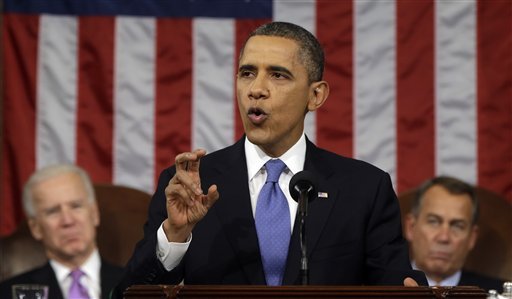 President Barack Obama, flanked by Vice President Joe Biden and House Speaker John Boehner of Ohio, gestures as he gives his State of the Union address during a joint session of Congress on Capitol Hill in Washington, Tuesday Feb. 12, 2013. (AP Photo/Charles Dharapak, Pool)