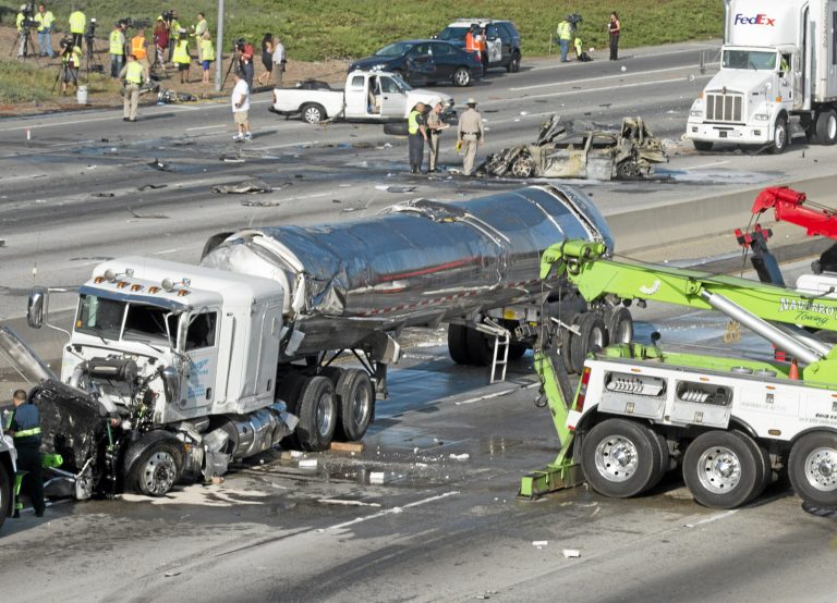 The California Highway Patrol investigates a crash on the 60-freeway at Santa Anita Ave. in South El Monte, Calif.,  involving several vehicles including a milk tanker on Thursday, Aug. 14, 2014. A 5-year-old girl was killed and several other people were injured in the fiery multi-vehicle crash involving three big rigs that shut down all lanes of a Los Angeles County freeway early Thursday, authorities said. (AP Photo/San Gabriel Valley Tribune, Keith Durflinger)