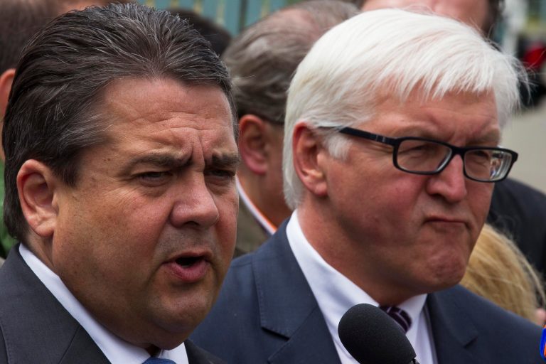   Social Democratic Party chairman Sigmar Gabriel, left, and the party's parliament floor leader Frank-Walter Steinmeier, right, brief the media after a meeting with Chancellor Angela Merkel at the chancellery in Berlin, Germany, Wednesday, June 13, 2012. German Chancellor Angela Merkel had talks with the country's opposition leaders to forge a compromise on proposals for a European growth initiative. (AP Photo/Markus Schreiber)  
