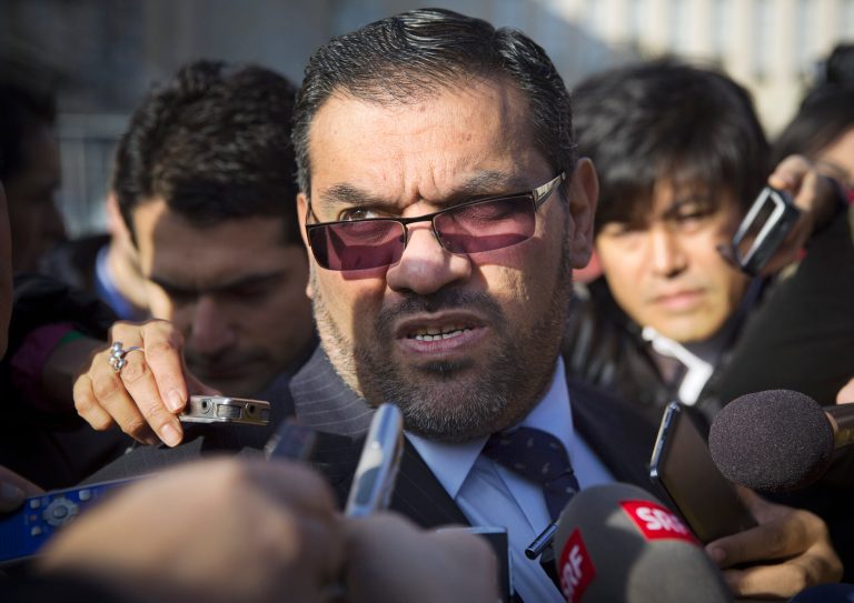 Anas al-Abdeh, center, a member of the Syrian National Coalition, Syria's main political opposition group, is surrounded by journalists after a meeting with a delegation of  the Syrian government at the United Nations headquarters in Geneva, Switzerland, Saturday, Jan. 25, 2014. The Syrian government and the country's opposition held direct talks on Saturday for the first time since they entered into a war three years ago, the UN said.  (AP Photo/Anja Niedringhaus)