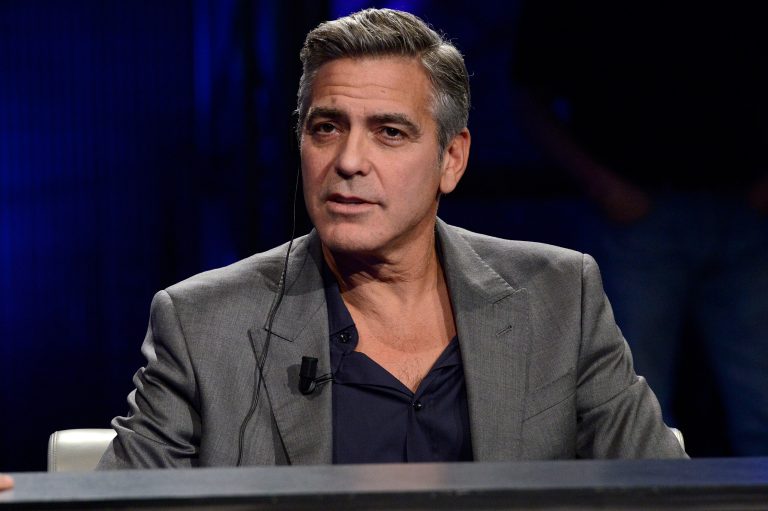 FILE - This Sunday, Feb. 9, 2014 file photo shows American actor George Clooney interviewed by Fabio Fazio during the Italian State RAI TV program 
