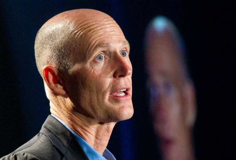  FILE - In this May 16, 2012 file photo, Florida Gov. Rick Scott speaks in Fort Lauderdale. Florida Gov. Rick Scott, long opposed President Barack Obama's remake of the health insurance market. After President Obama won re-election, the Republican governor softened his tone. He said he wanted to 
