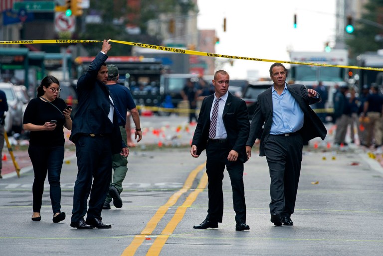 New York Gov. Andrew Cuomo, right, walks from the scene of an explosion in Manhattan's Chelsea neighborhood, in New York, Sunday, Sept. 18, 2016. (AP Photo/Craig Ruttle)