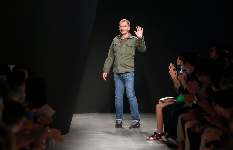 German designer Tomas Maier acknowledges the applause at the end of the presentation of the Bottega Veneta men's Spring-Summer 2015 collection, part of the Milan Fashion Week, unveiled in Milan, Italy, Sunday, June 22, 2014. (AP Photo/Luca Bruno)