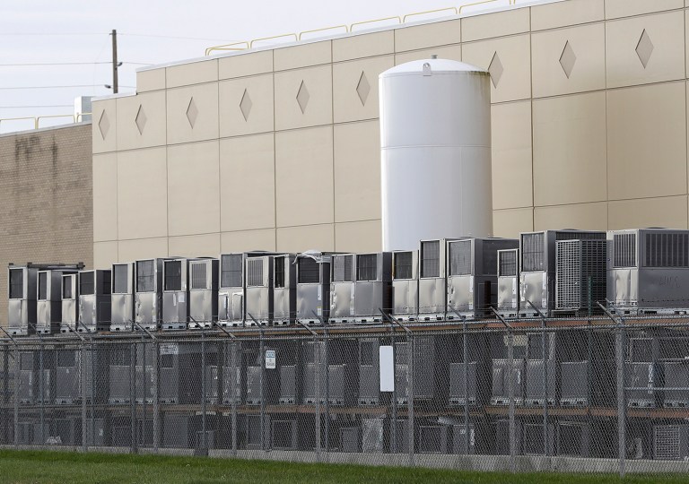Air conditioning units are stacked outside the Carrier Corp. plant in Indianapolis. Carrier and President-elect Trump reached an agreement to keep nearly 1,000 jobs in Indiana. (AP Photo/Darron Cummings)
