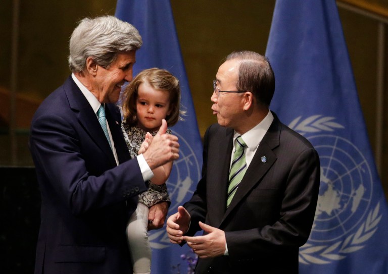 U.S. Secretary of State John Kerry holds his granddaughter Isabel Dobbs-Higginson as he talks to Secretary General Ban Ki-moon after signing the Paris Agreement on climate change, Friday, April 22, 2016 at U.N. headquarters. (AP Photo/Mark Lennihan)