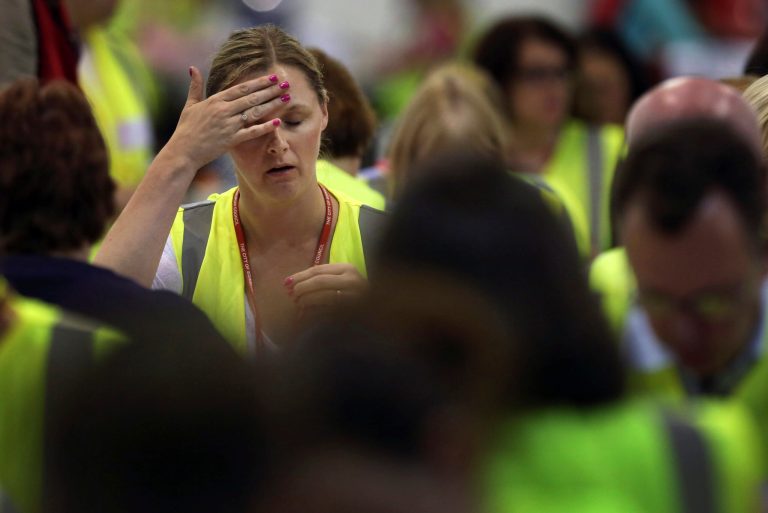 An official reacts as counting continues in the Scottish Independence Referendum at the Royal Highland Centre in Edinburgh, Scotland, Friday, Sept. 19, 2014. From the capital of Edinburgh to the far-flung Shetland Islands, Scots embraced a historic moment - and the rest of the United Kingdom held its breath - after voters turned out in unprecedented numbers for an independence referendum that could end the country's 307-year union with England.  (AP Photo/David Cheskin)