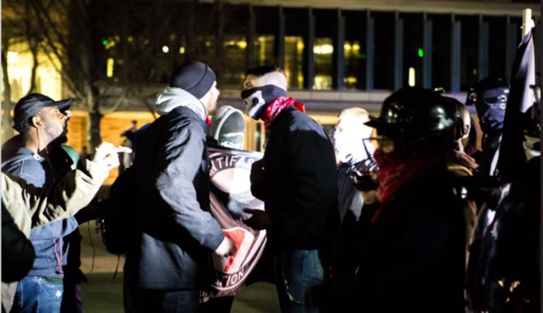 According to reports, protests outside the venue where Turning Point USA's Charlie Kirk was speaking on Friday were largely peaceful until a third group chanting Nazi slogans stormed the area. (Screenshot via Charlie Kirk/Twitter)