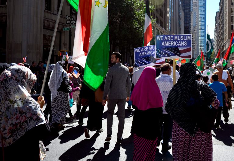 Flags of immigrant nations are carried during the Muslim Day Parade on Madison Ave. Sunday, Sept. 25 2016, in New York. (AP Photo/Craig Ruttle)