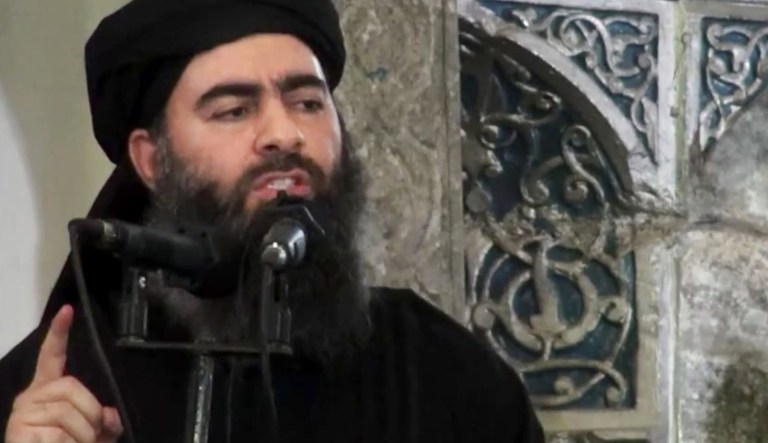 This file image made from video posted on a militant website July 5, 2014, purports to show the leader of the Islamic State group, Abu Bakr al-Baghdadi, delivering a sermon at a mosque in Iraq during his first public appearance. An Iraqi government official claimed on Tuesday that al-Baghdadi was seriously wounded in a recent coalition airstrike. (Militant video via AP, File)