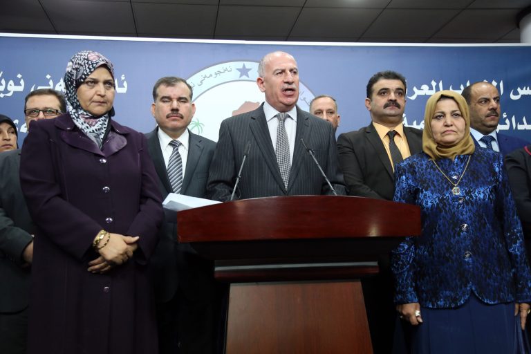 Iraqi former Parliament speaker and the chairman of the Sunni Arab Coalition Osama al-Nujaifi, center, speaks to the media during a press conference in Baghdad, Iraq, Sunday, July 13, 2014. Iraq's deadlocked parliament ended its second session after just 30 minutes Sunday without making any progress toward forming a new government that can unite the country and confront the Sunni militant blitz that has seized control of a huge chunk of the country. (AP Photo/Karim Kadim)