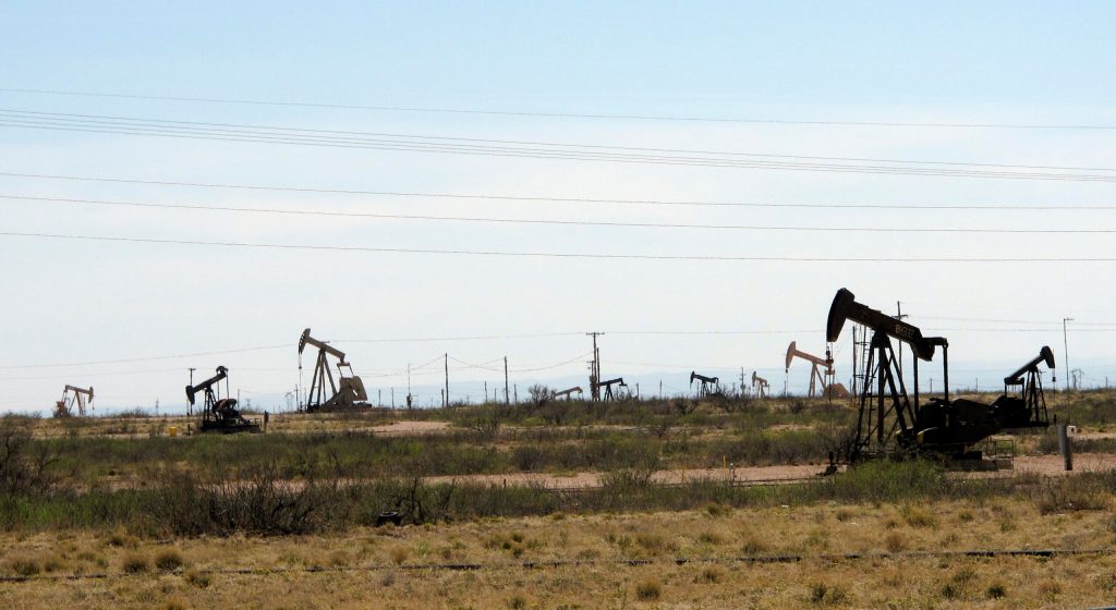 New Mexico oil country struggles as cities boom