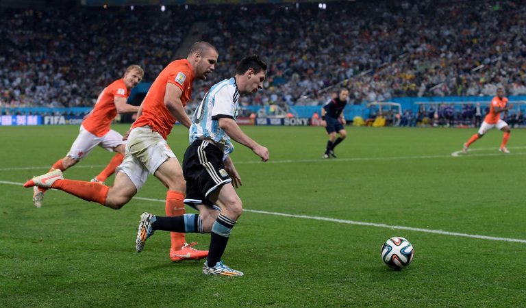 Argentina's Lionel Messi, center, runs with the ball during the World Cup semifinal soccer match between the Netherlands and Argentina at the Itaquerao Stadium in Sao Paulo Brazil, Wednesday, July 9, 2014. (AP Photo/Manu Fernandez)