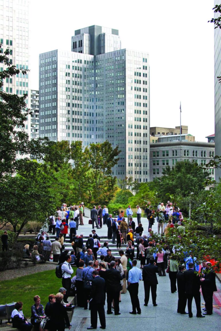 CLARIFIES POSITION OF GATEWAY THREE OFFICE BUILDING. - People evacuated by Pittsburgh Police from the Gateway Three office building, far left rear, wait outside as the police negotiate with a man who claims to have a bomb in a suite in the sixteenth floor, in downtown Pittsburgh Friday, Sept. 21, 2012. (AP Photo/Keith Srakocic)