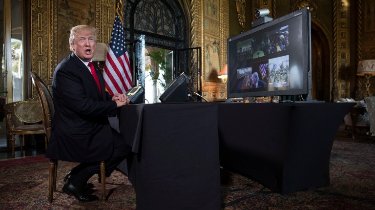 President Trump and Melania took calls Sunday from children calling into NORAD's Santa tracking hotline. (AP Photo/Carolyn Kaster)