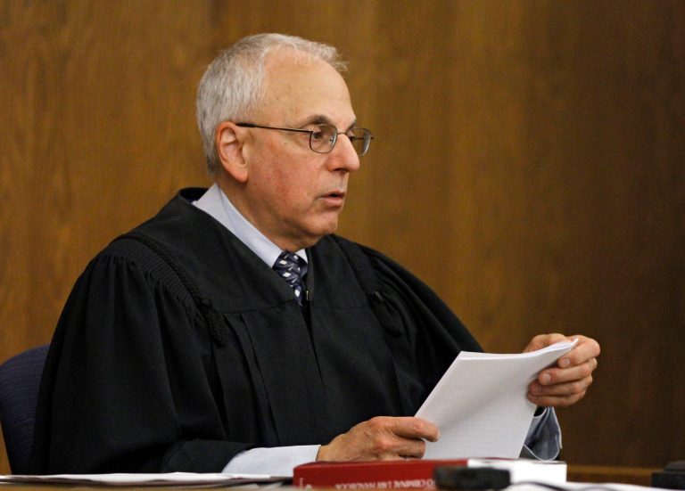   Cuyahoga County Judge Stuart Friedman reads his ruling on a death penalty case in Cleveland, Friday, June 15, 2012. Friedman ruled that condemned murderer Abdul Awkal is not mentally competent to be executed for the death of his estranged wife and brother-in-law in 1992. The decision comes just a week after Ohio Gov. John Kasich ordered a last-minute reprieve, hours before Awkal was set to die. (AP Photo/Mark Duncan)  
