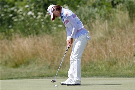 Na Yeon Choi, of South Korea, putts on the 11th hole during the final round the U.S. Women's Open golf tournament, Sunday, July 8, 2012, in Kohler, Wis. Choi birdied the hole and went on to win the championship. (AP Photo/Jeffrey Phelps)