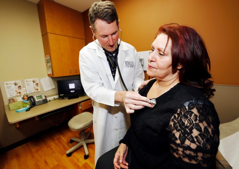 Dr. Michael Russum checks patient Ruby Giron in Denver Health Medical Center's primary care clinic, which is located in a low-income neighborhood in southwest Denver. Under the new GOP healthcare proposal, which could roll back Medicaid expansion and take away subsidies to help pay for insurance, Denver Health could absorb a revenue loss, a problem that it will share with large public health systems across the country that serve low-income patients. (AP Photo/David Zalubowski)