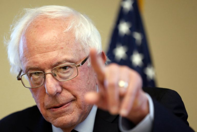 Sanders linked climate change and campaign finance Saturday as he blasted his Republican opponents. (AP Photo/Jim Cole)