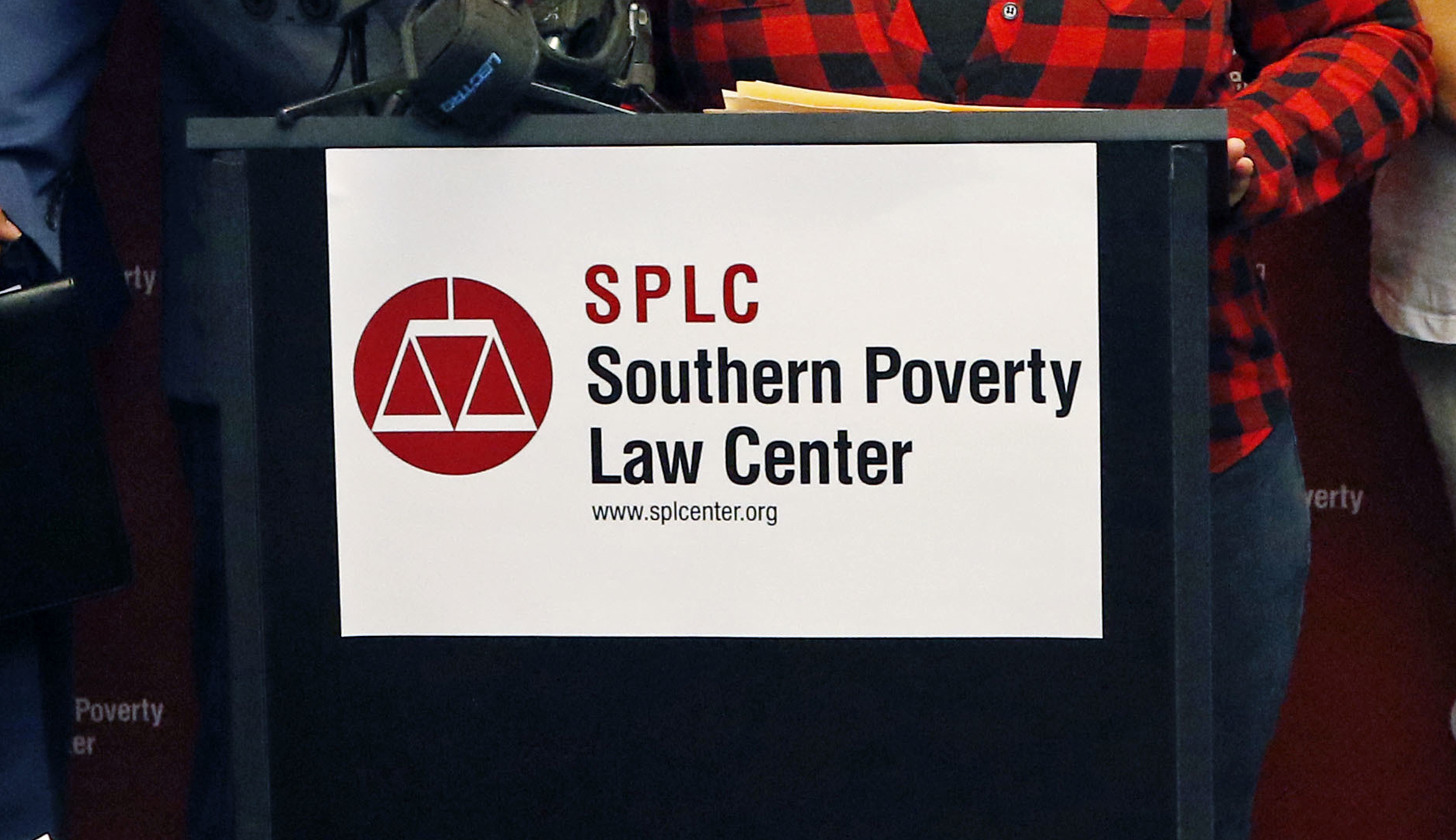 A sign containing the logo of the Southern Poverty Law Center.
