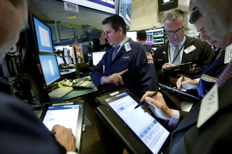 Economists on an advisory board for the American Bankers Association projected Wednesday that the U.S. economy will grow slightly faster in 2016 and 2017 than it did in 2015. (AP Photo)