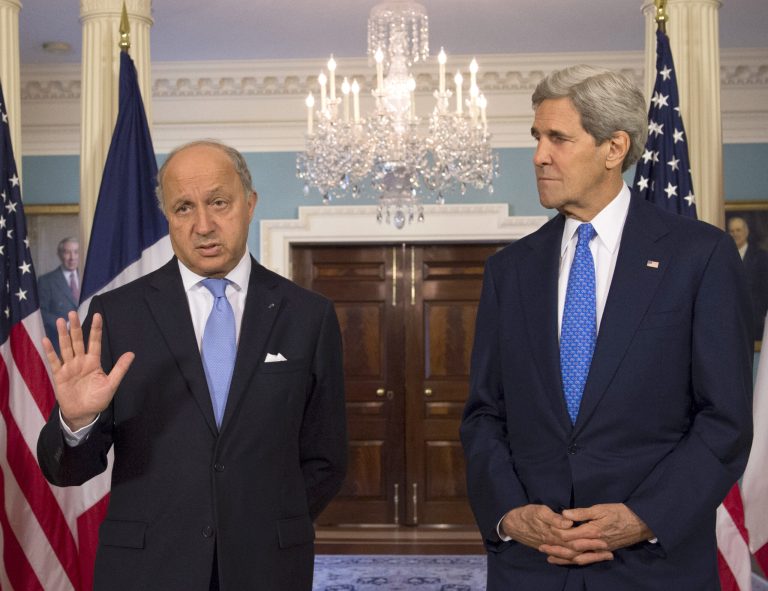 Secretary of State John Kerry listens as French Foreign Minister Laurent Fabius speaks prior to their meeting at the State Department in Washington, Tuesday, May 13, 2014. (AP Photo/Molly Riley)
