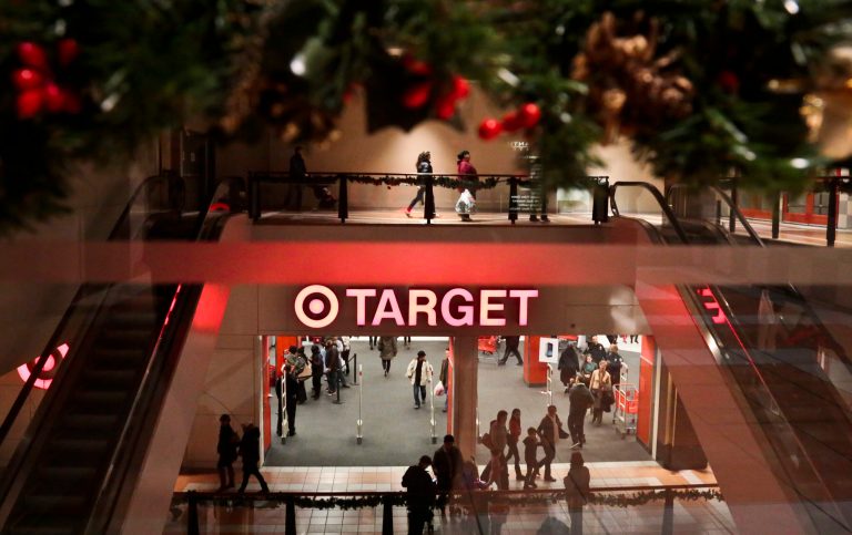 Holiday trimmings greet shoppers around the main entry of a Target on Saturday, Nov. 23, 2013, in New York. (AP/Bebeto Matthews)
