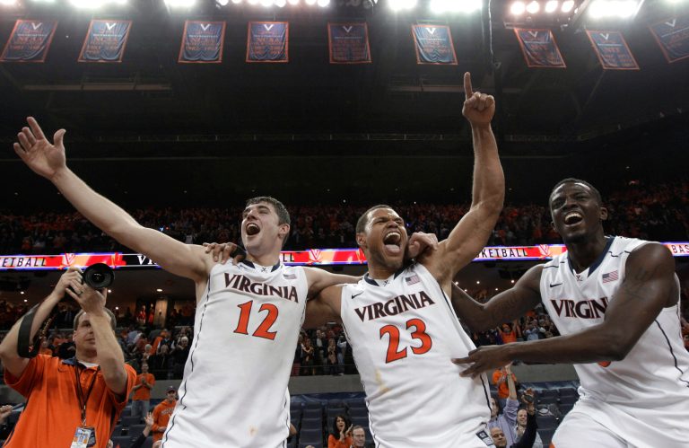 Steve Helber/AP
Virginia's Joe Harris, Justin Anderson and Teven Jones celebrate Virginia's 73-68 win over Duke in Charlottesville on Thursday.