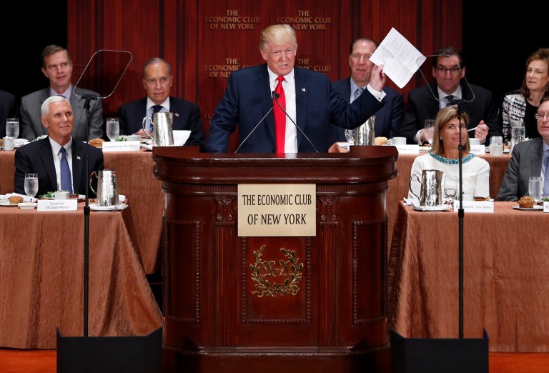 Republican presidential candidate Donald Trump holds up his notes as he speaks at a luncheon for the Economic Club of New York in New York, Thursday, Sept. 15, 2016. (AP Photo/Seth Wenig)
