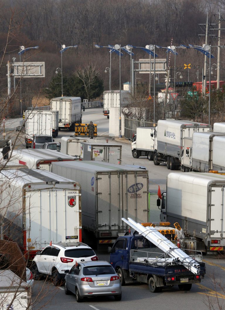 South Korean vehicles leave for a joint industrial complex of North Korean city of Kaesong at the customs, immigration and quarantine office, near the Demilitarized Zone (DMZ) of Panmunjom in Paju, north of Seoul, South Korea, Thursday, March 28, 2013. Raising tensions with South Korea yet again, North Korea said it cut the last military hotline with Seoul because there was no need for communications between the countries in a situation 