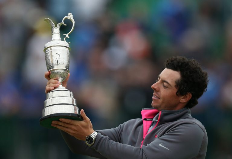 Rory McIlroy of Northern Ireland holds up the Claret Jug trophy after winning the British Open Golf championship at the Royal Liverpool golf club, Hoylake, England, Sunday July 20, 2014. (AP Photo/Scott Heppell)