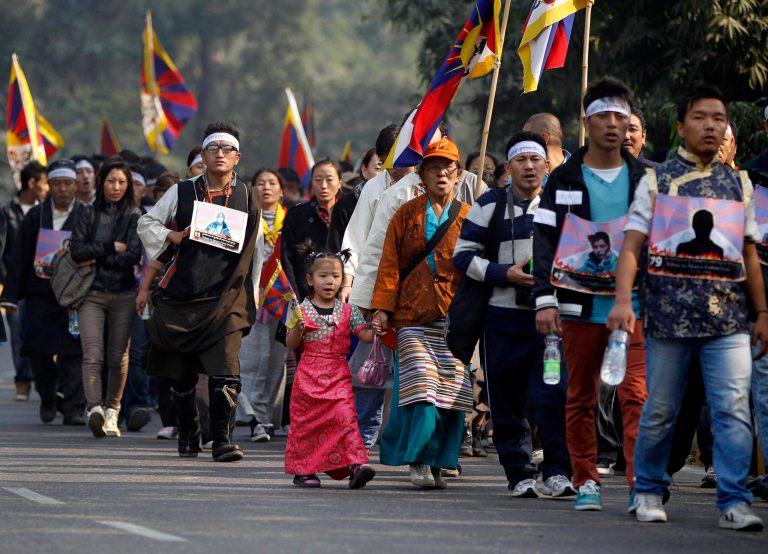   Exile Tibetans march wearing portraits of Tibetans who have allegedly immolated themselves in protest against Chinese rule, during a rally to mark World Human Rights Day in New Delhi, India, Monday, Dec. 10, 2012. At least 86 people have set themselves on fire since 2009. Tibetans also mark Dec. 10 as Nobel Peace Prize Day, the day the Dalai Lama received the Nobel peace prize in 1989. (AP Photo/Mustafa Quraishi)  