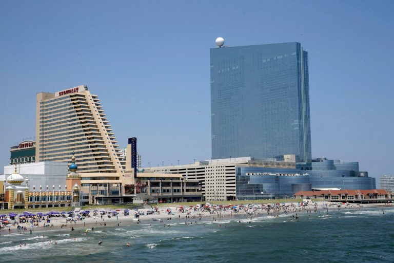 FILE - In this Wednesday, July 23, 2014 file photo, the Showboat Casino Hotel, left, and the Revel Casino Hotel, right, are seen along the Boardwalk in Atlantic City, N.J. Showboat is due to close on Sunday, Aug. 31, 2014 and Revel will close its hotel Monday and casino on Tuesday. Although, Caesars Entertainment spokesman Gary Thompson told The Associated Press that Caesars officials were showing the Showboat on Tuesday afternoon to a party that had expressed interest. (AP Photo/Mel Evans, file)
