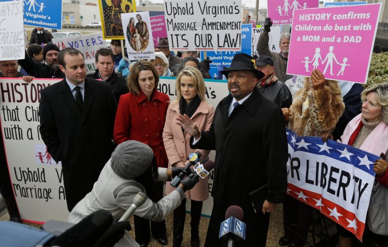 Former Republican lieutenant governor candidate E.W. Jackson, front right, speaks to the media during a demonstration outside federal court in Norfolk, Va., on Feb. 4. (AP Photo/Steve Helber)