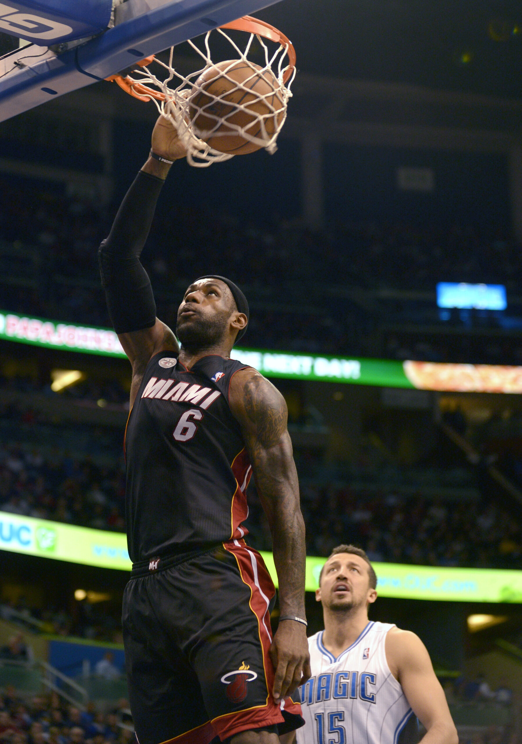 James, Bosh lead Heat over Magic 112-110 in OT