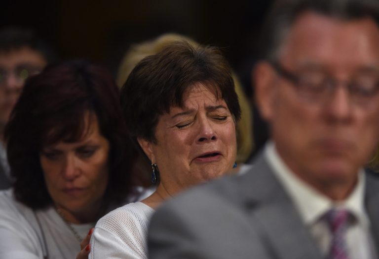 Liz Sullivan, mother of Kathryn Steinle, is consoled by Sabine Durden, left, while listening to testimony by Jim Steinle during a Senate Judiciary hearing in Washington, Tuesday, July 21, 2015. The family told Congress they support changing the laws that allowed her alleged killer to remain in the United States and protected in the sanctuary city of San Francisco despite being deported several times. (AP Photo/Molly Riley)