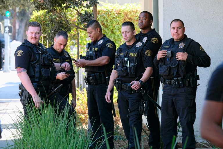 The nation is divided on how best to address criminal justice issues, including tensions between police and communities. (AP Photo/Richard Vogel)