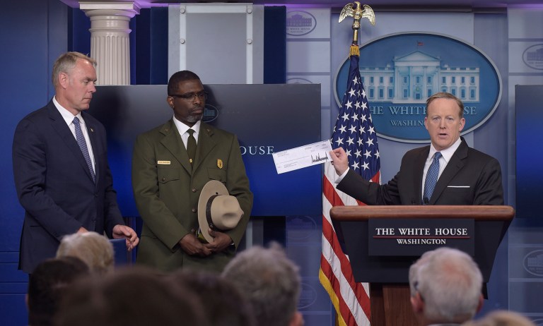 Donating tax dollars to a government agency is far from pledging to take no White House salary. (AP Photo/Susan Walsh)