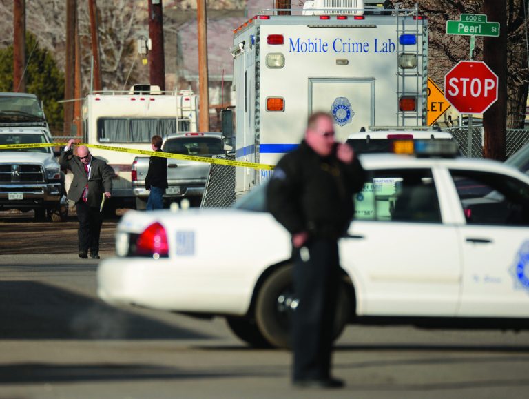 Police investigate the scene of a shooting where a woman and two children were found dead and a third child wounded in the Globeville neighborhood in Denver on Wednesday, Feb. 6, 2013. The shooting appeared to have been isolated and there was no indication a shooter is on the loose, police Major Crimes Cmdr. Ron Saunier said. (AP Photo/The Denver Post, RJ Sangosti) MAGS OUT; TV OUT; INTERNET OUT