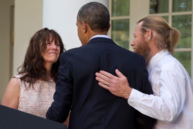 Parents of U.S. Army Sgt. Bowe Bergdahl, Jani Bergdahl, left, and Bob Bergdahl, turn to President Barack Obama after he spoke in the Rose Garden of the White House in Washington, Saturday, May 31, 2014, after the announcement that Bowe Bergdahl has been released from captivity in Afghanistan. Bergdahl, 28, had been held prisoner by the Taliban since June 30, 2009. He was handed over to U.S. special forces by the Taliban in exchange for the release of five Afghan detainees held by the United States. (AP Photo/Jacquelyn Martin)