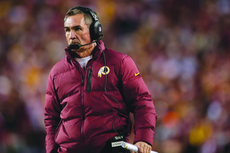 Evan Vucci/AP
Redskins coach Mike Shanahan kept an ailing Robert Griffin III in the game Sunday until he suffered a worse injury to his knee.