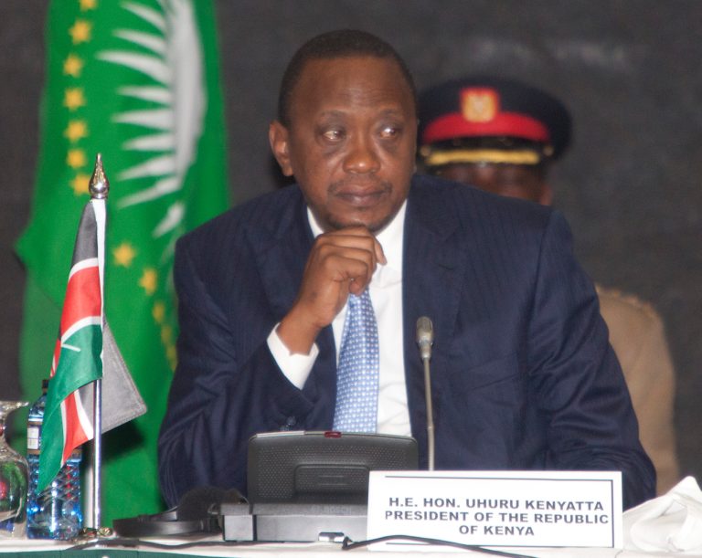 President of Kenya, Uhuru Kenyatta, listens during the AU Summit, Tuesday, Sept. 2, 2014, in Nairobi, Kenya.  A one-day African Union Peace and Security Summit  started in Nairobi, Kenya, Tuesday. (AP Photo/Sayyid Azim)