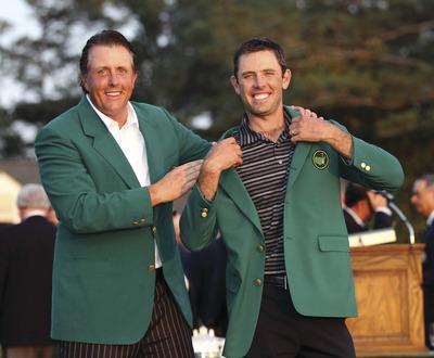 Ross Kinnaird/Getty Images
Charl Schwartzel, right, won the 2011 Masters championship and was presented with the Green Jacket by 2010 Masters champion Phil Mickelson.