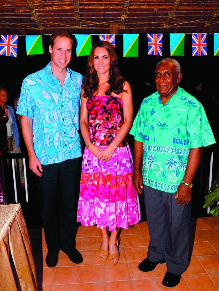 Britain's Prince William, left, and wife Kate, the Duchess of Cambridge, center, pose for a photo with His Excellency the Governor General of the Solomon Islands, Sir Frank Kabui, in Honiara Sunday Sept. 16, 2012. The royal couple is on a nine-day tour of the Far East and South Pacific in celebration of Queen Elizabeth II's Diamond Jubilee. (AP Photo/William West, Pool)