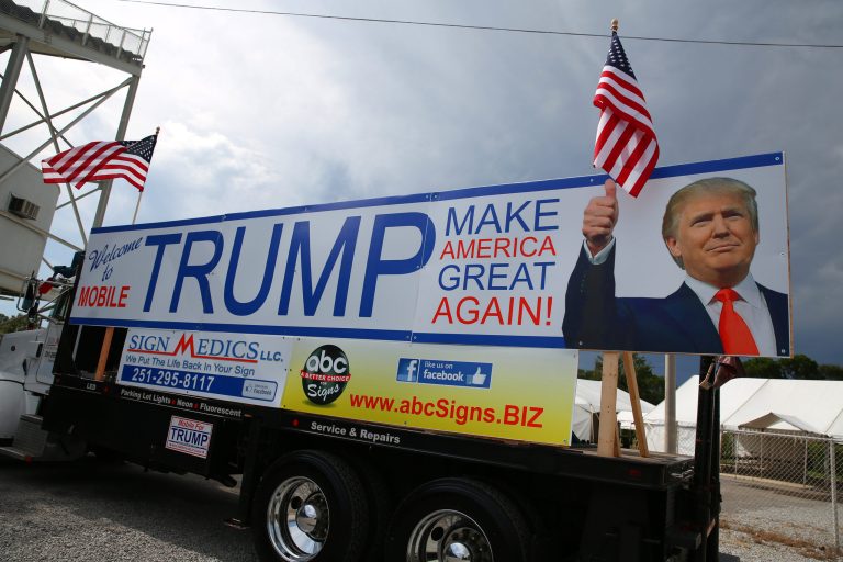 Donald Trump supporters wait in line outside Ladd-Peebles Stadium hours before the start of a rally expected to draw 40,000 people in Mobile, Ala., Friday, Aug. 21, 2015. (Sharon Steinmann/AL.com via AP)