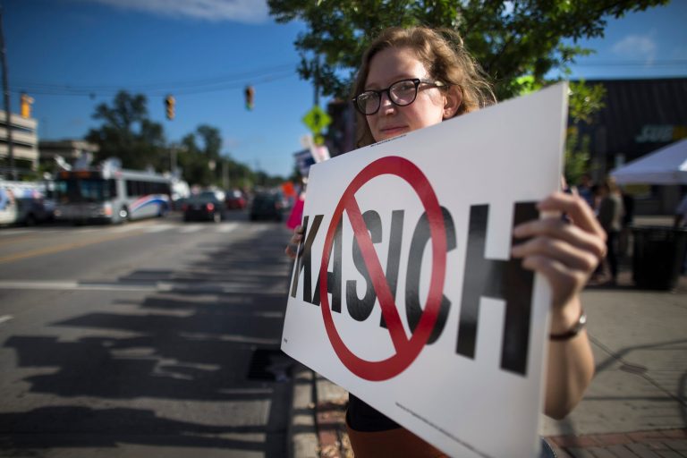 A protester outside of Ohio Gov. John Kasich's presidential announcement on July 21, 2015. Associated Press photo.Â 